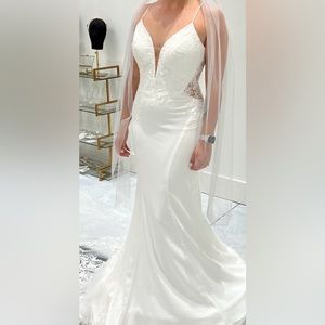 Never worn, still has tags, comes with the vail as well. No alterations